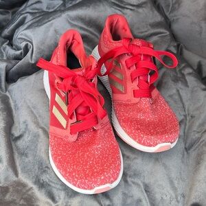 Red Adidas running shoes